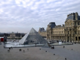 Why is there a pyramid in the Louvre Museum